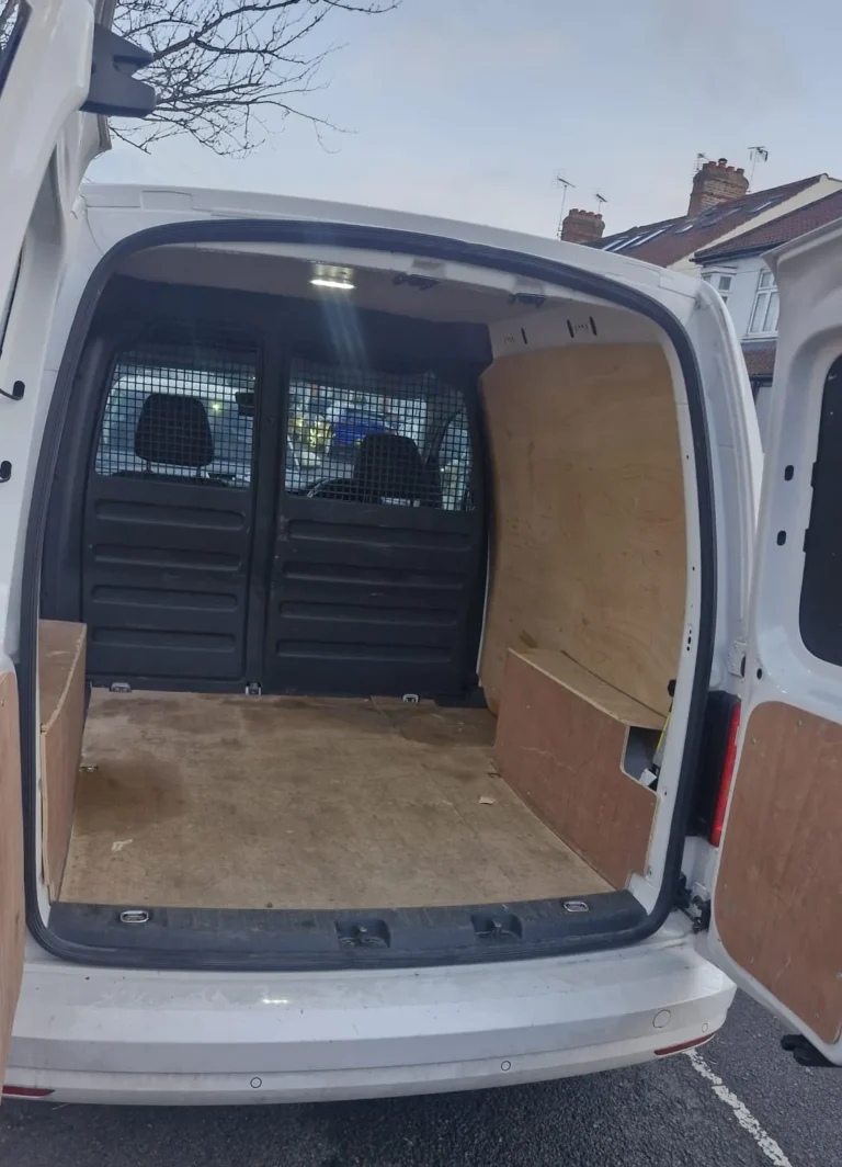Ply-lined load space of a VW Caddy small van, First Choice Transportation