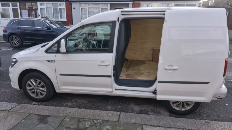 VW Caddy small van with side loading door open, First Choice Transportation