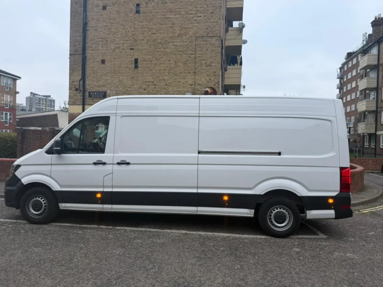 Side view of a First Choice Transportation VW Crafter long wheelbase high roof van